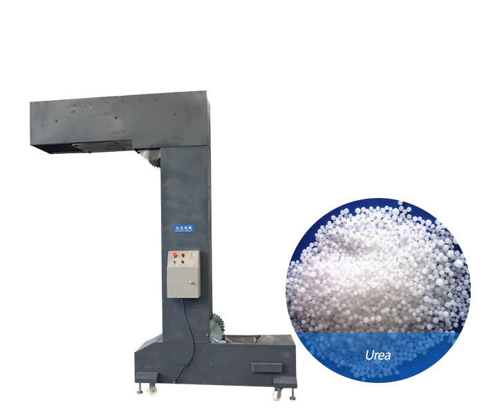 Urea conveying bucket elevator