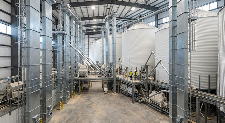 Modern Commercial Grain Storage and Processing Plant Interior Featuring Heavy-Duty Galvanized Steel Bucket Elevators